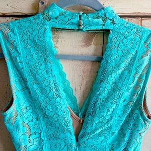 Like new Bebe dress size XS teal lace body forming